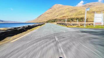 Driving fast on scenic road with mountains and lakes, wild Atlantic way hyper lapse, Delphi, county Mayo, Ireland video
