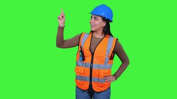 Latin Construction Worker Woman Pointing on Green Screen video