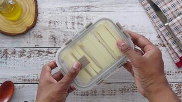 top view of cheese slice in a box video
