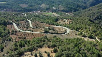 Aerial view of a winding country road in Vallclara video