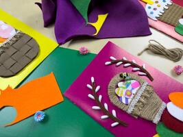 Fun process of creating colorful Easter cards using felt, yarn, and decorative accents. Perfect for expressing creativity and celebrating the joy of spring and Easter festivities photo