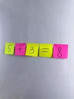 Colored cards with numbers for teaching algebraic operations to child from early age photo