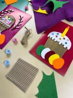 Engaging process of creating beautiful Easter cards using vibrant felt, yarn, and paper. Perfect materials for crafting unique cards and celebrating joyful spring moments photo