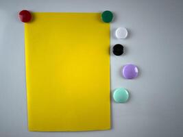 Note attached to whiteboard using variety of magnets, enhances organizational and planning efforts in both educational and corporate settings ideal for boosting productivity photo