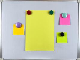 Whiteboard featuring multiple notes with magnets perfect for organizing tasks reminders and schedules in office environment, enhancing productivity and efficiency, improving overall organization photo