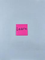 Vertical photo of sticky note with word Learn. Study and personal development, conceptual photo about importance of learning and personal development. Getting education and new knowledge
