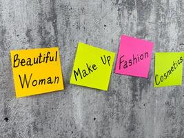 Fashion industry about beautiful woman with words on stickers. Current words about the need for cosmetics to create attractive image in public. Highlight your face with makeup photo