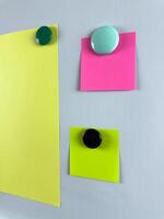 Notes pinned to whiteboard with magnets suitable for tracking tasks reminders and planning. Ideal for educational and professional settings enhancing organizational skills photo