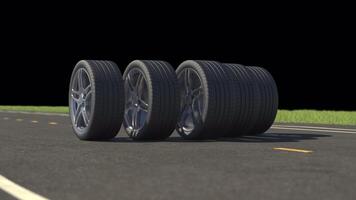 Loop car tires rolling on asphalt in the summer with alpha channel video