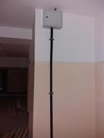 Electrical installation revealed within a newly renovated indoor space during construction work photo