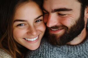 Young couple sharing a joyful moment together while smiling and enjoying each other's company in a cozy setting photo