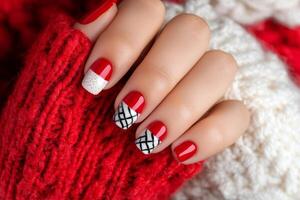 Stylish red and black winter nail art design showcasing cozy sweater vibes photo