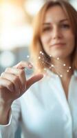 Woman interacts with digital connections in an office setting during daylight hours photo