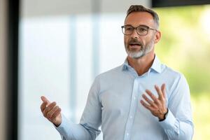 Business presentation by a middle-aged man in a modern office setting during daylight hours photo