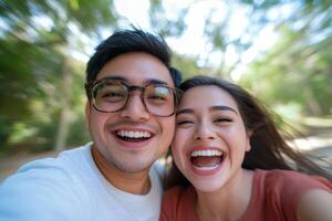 Joyful couple enjoying a sunny day outdoors in a park while capturing a fun moment together photo