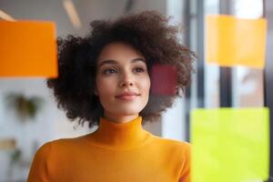 Creative professional brainstorming ideas in a modern office with colorful stickers during the day photo