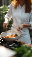 Cooking fresh vegetables in a sunny kitchen garden while wearing a chef's coat photo