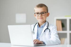 Young boy dressed as a doctor working on a laptop in a modern office setting with medical props photo