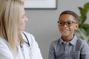Young boy smiles warmly during a friendly checkup with his healthcare provider in a bright office setting photo