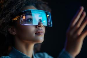 Young woman explores technology with futuristic augmented reality goggles in a dark setting photo