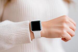 Stylish smartwatch displayed on wrist, showcasing modern technology and personal accessories in cozy indoor setting photo