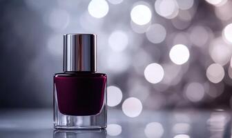 a bottle of nail polish on a table with a blurred background photo
