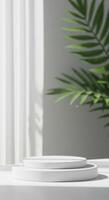 Minimalist white cylinder platform for product display, soft background photo