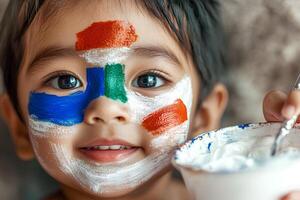 A portrait of a cute Indian little boy with colorful paint on his face, showcasing innocence and joy, capturing the playful and cultural expression photo