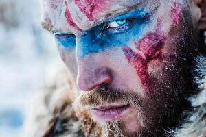 Intense close-up portrait of a man with a beard and artistic face paint, creating a dramatic and expressive look photo