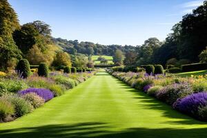 Manicured lawn stretching through vibrant flowerbeds in a picturesque garden photo
