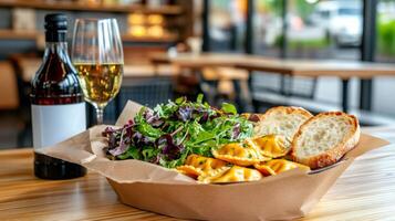 Ravioli with salad and toasted bread served with white and red wine in a restaurant photo