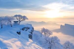 Sunrise illuminating snowy mountains and frozen trees in South Korea photo