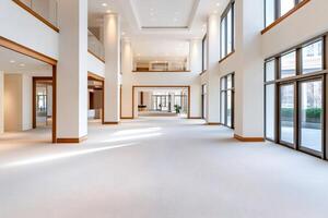 Large empty modern lobby with white columns and carpet photo