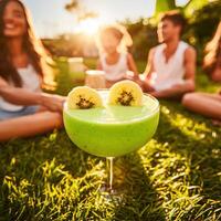 A group of people sitting on the grass photo