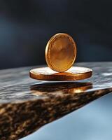 A gold coin sitting on top of a rock photo