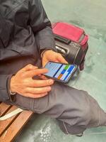 Traveler Using Smartphone While Waiting, Digital Communication, Modern Journey. High quality photo