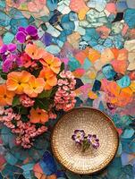 A vase of flowers on a table with a mosaic pattern photo