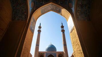 The view from inside an archway in a mosque photo
