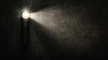 Bright handheld torch piercing the dim surroundings photo