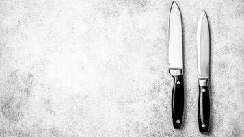 Professional Vegetable and Fish Knives on Textured Gray and White Surface photo