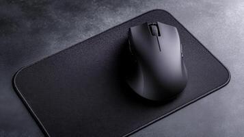 Sleek Mouse Resting On Textured Surface Pad photo