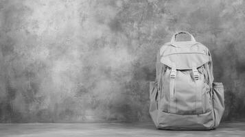 A Light Backpack Against a Textured Wall photo