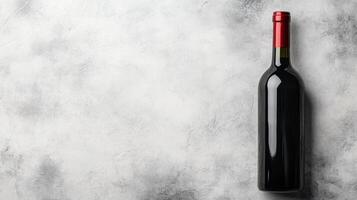 Dark Wine Bottle on Textured Light Background photo