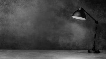 Black Adjustable Lamp on Dark Textured Space photo