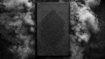 Dark textured book with embossed geometric design on cover photo