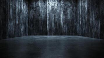 Dark textured walls surround an empty concrete floor spac photo