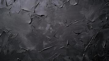 Textured Black Paint Strokes on Dark Canvas Surface photo