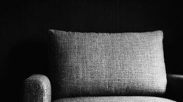 Textured Pillow on an Armchair in Dim Light photo
