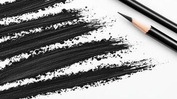 Black Pencil Strokes and Graphite Texture on White Paper photo