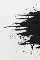 Black Ink Splatter on White Paper with Abstract Design photo